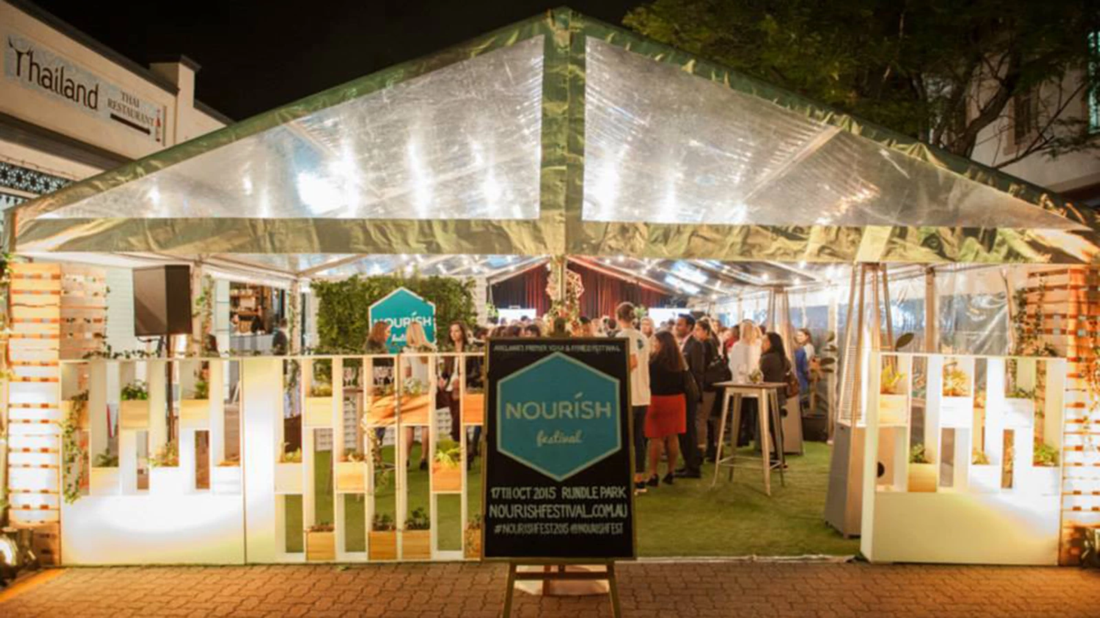 Nourish Festival event signage tent and chalkboard.
